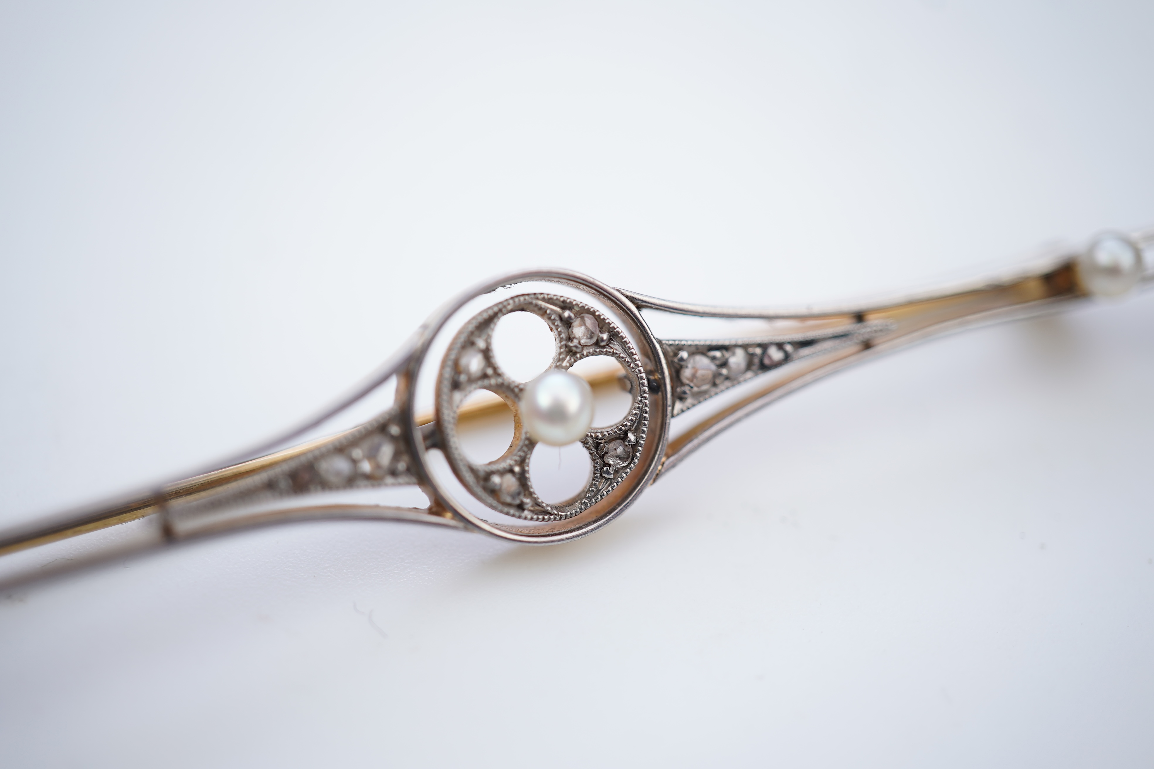 Four gold and gem-set bar brooches, early 20th century